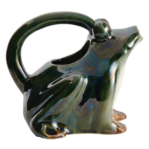 A green stoneware watering pitcher designed to resemble a frog.